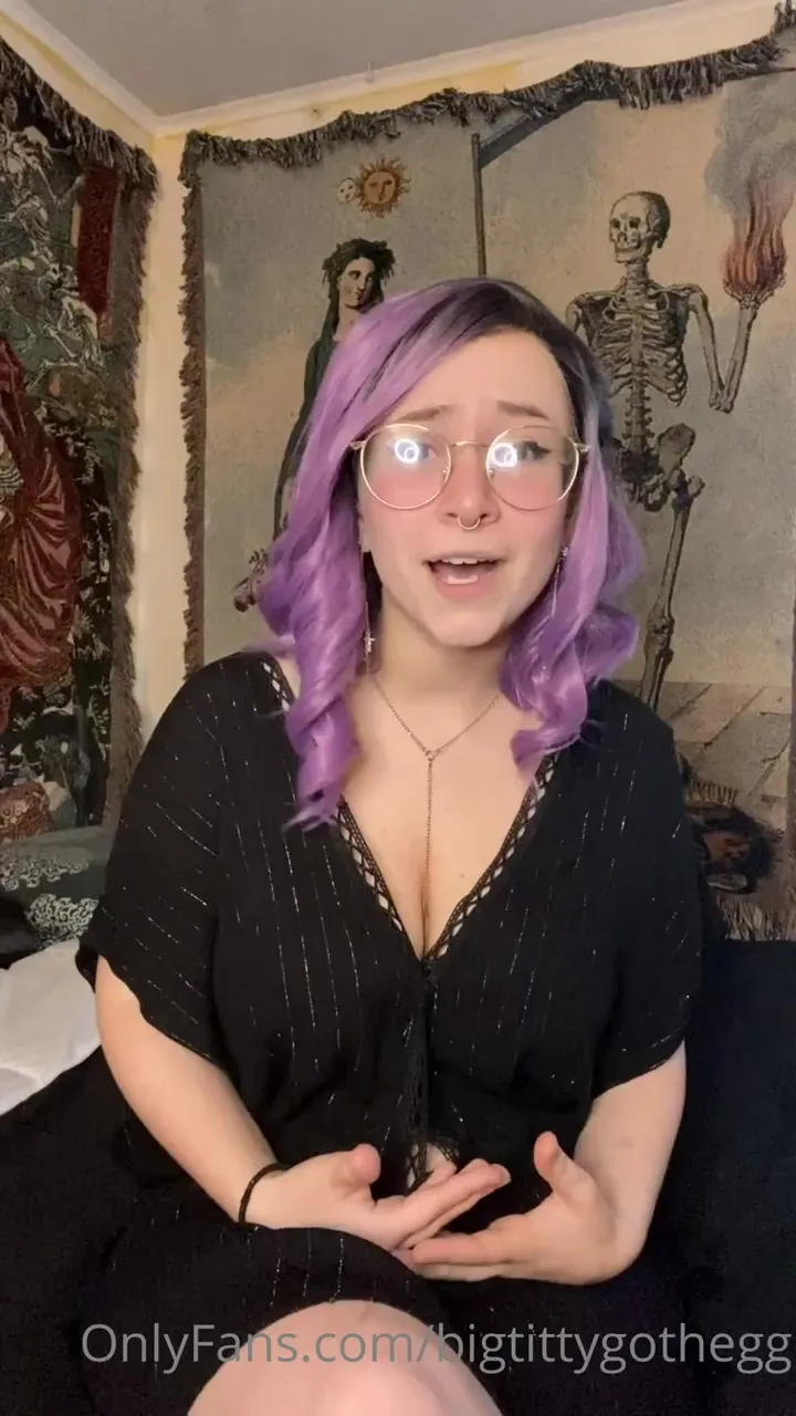 Gothic tapestry room, Big Titty Goth Egg chats in a low black top