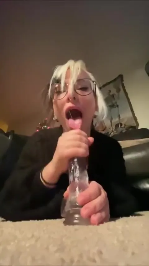 On the couch, Bigtittygothegg rides a clear toy hard from behind