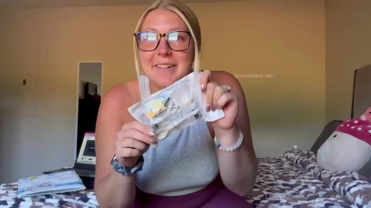 Clipping metal clamps onto her nipples, Anne squeezes her heavy tits together and grins