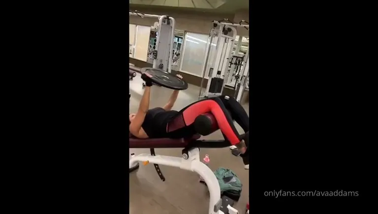 Sunrise sweat as Ava Addams hammers the gym machines in tight black and red leggings
