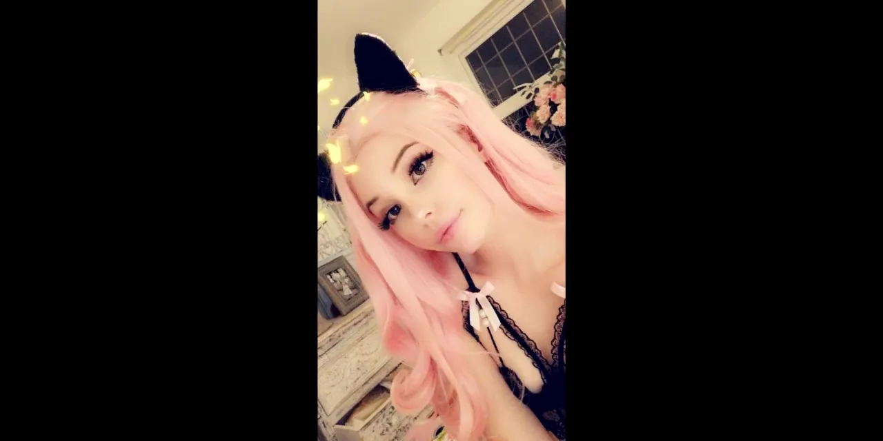 Belle Delphine poses in black lace and cat ears, legs up for a horny mirror selfie
