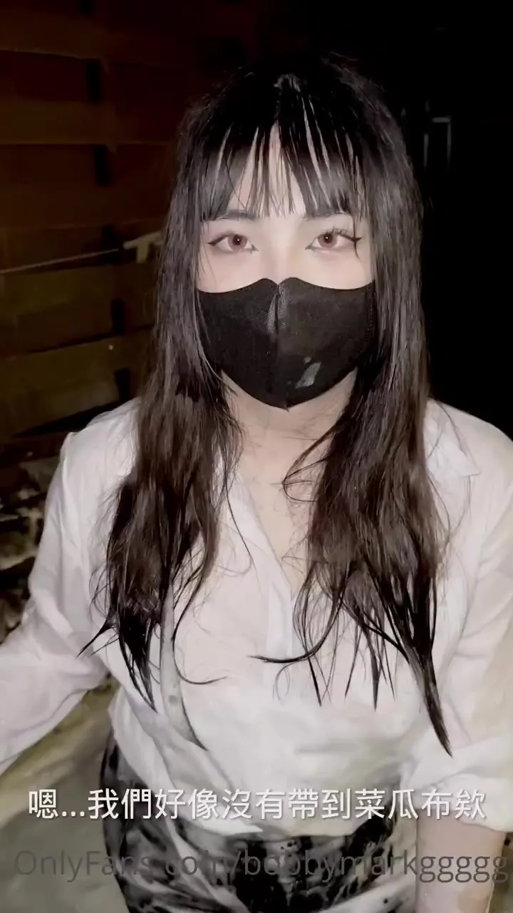 Kinoko Cheng yanks her soaked shirt open and drops one heavy tit out, cursing the whole time