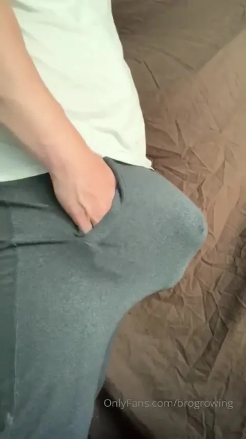 GrowingMuscleBro pulls his sweats down and groans as his cock springs free