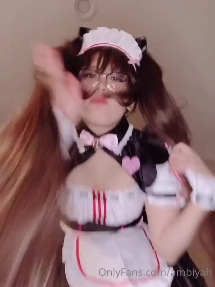 Grinding down on her pink toy, Mae moans and rides it in a slutty maid outfit