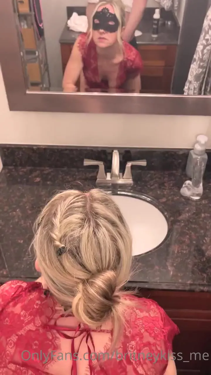 Britney bends over the bathroom sink, moaning as he fucks her from behind in her red lace
