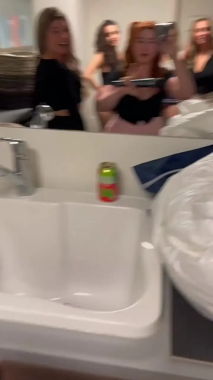 Baring her big tits for her hungry friends, Isla Moon grins and shows off
