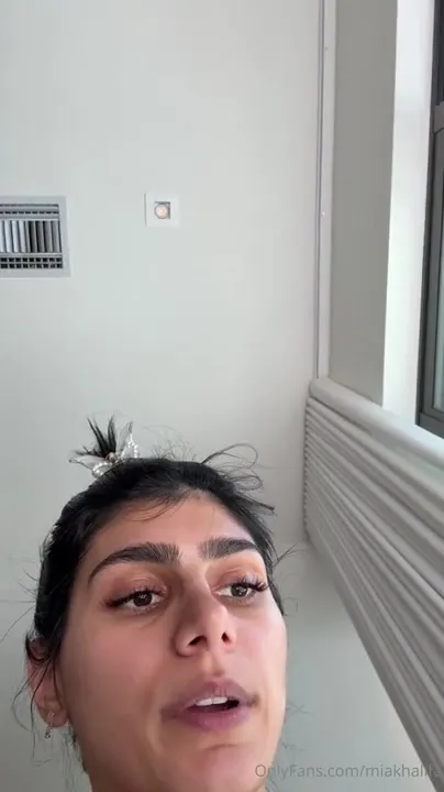 Mia Khalifa lights up a blunt, shaking all over in black thong before the shower