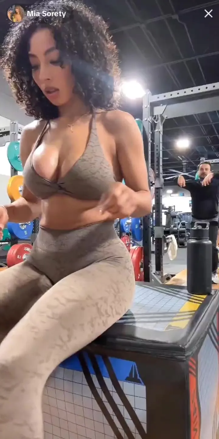 Gray halter and animal-print leggings, Mia Sorety is one horny little tease on the gym bench
