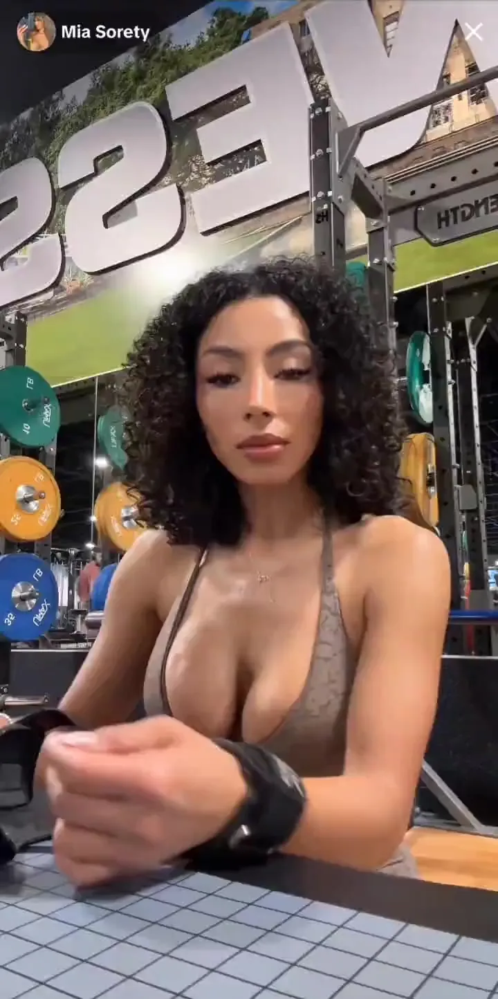 Gym floor flexing: Miasorety in beige leggings tugs her sports bra down to spill her tits