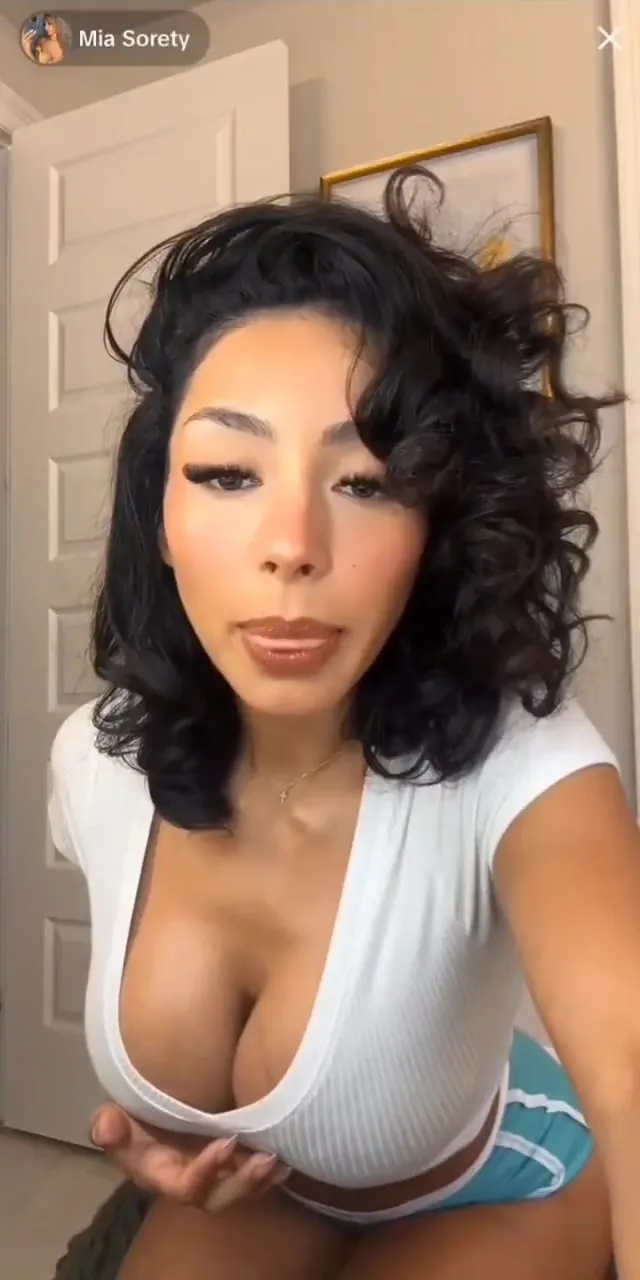 Mia Sorety pulls her top down, tits out, then rubs her pussy through teal shorts