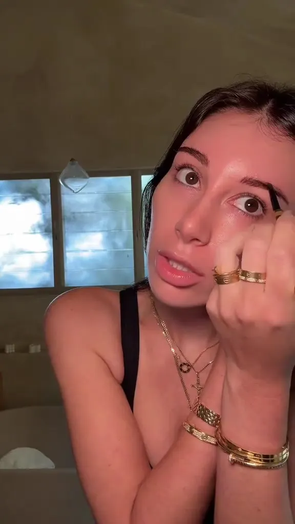 Mikaela Testa dolls up her face with gold hoops, dirty grin and a sultry wink