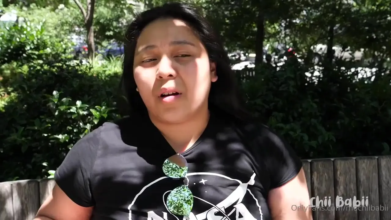 Peeling her shorts down, Mochii Babii flashes her ass on the city stairs and munches donuts on a bench