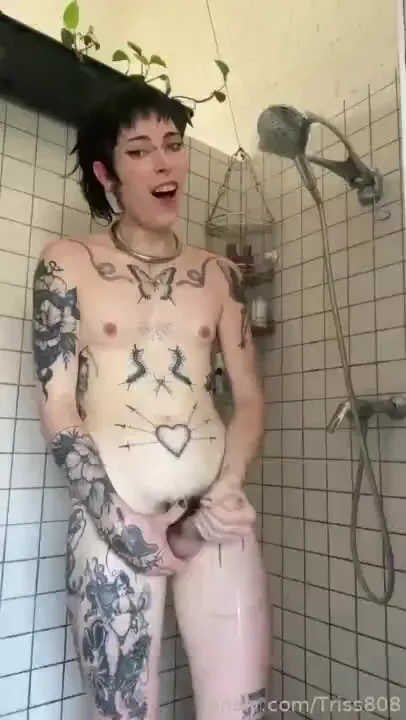 Nicole jerks her hard cock under the running shower