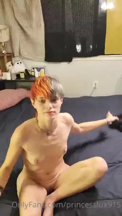 On the black sheets, Princess Lux peels off her denim shorts and fucks herself with a purple dildo