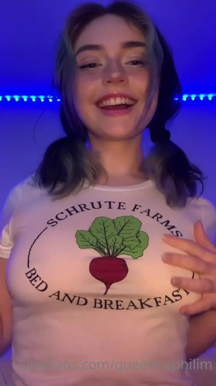 Queen Nephilim soaks her shirt under blue lights and flashes her pierced tits