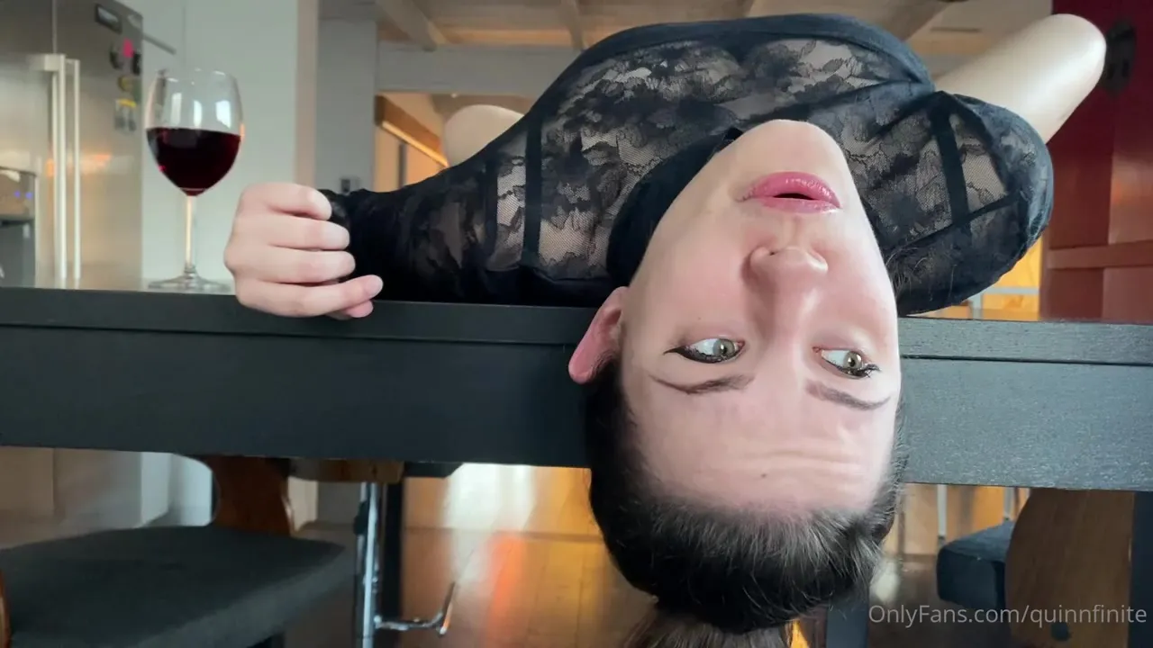 Hanging upside down off the counter, Quinn Finite licks her lips like she's hungry for it