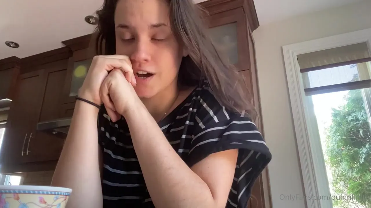 Quinn Finite leans in close, hands waving as she chats away in the kitchen