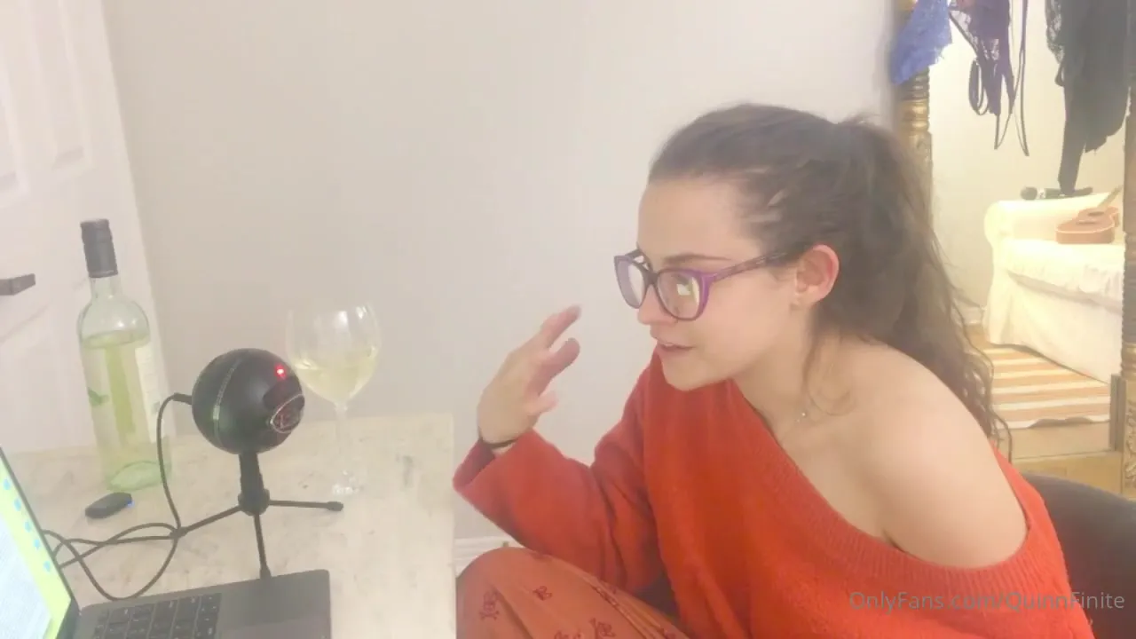 Sipping white wine and chatting in an off-shoulder orange sweater, Quinnfinite keeps the talk flowing