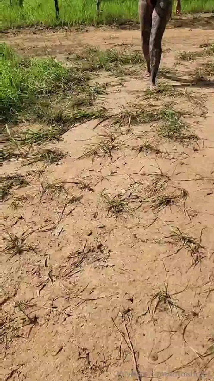 Muddy trail mess: Muddy hauls brush in her black thong, dirt on every inch
