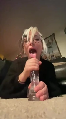 On the couch, Bigtittygothegg rides a clear toy hard from behind