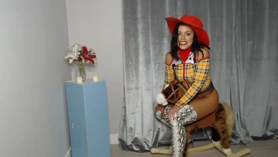 Adriana Chechik rides a rocking horse like it owes her money