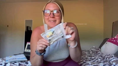 Clipping metal clamps onto her nipples, Anne squeezes her heavy tits together and grins