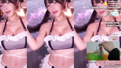 Bouncing her tits in a tiny Xmas bikini, AsianBunnyx teases her stream crowd