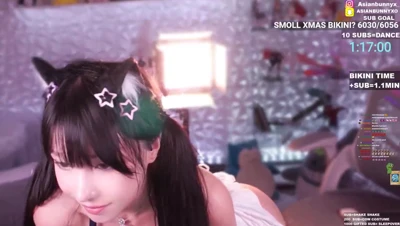 Dancing hungry in a tiny white Xmas bikini, AsianBunnyx sways those hips slutty and slow
