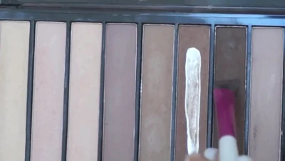 Belle Delphine lines her eyes and coats her lashes, chasing that dirty glam look