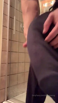 Rubbing his hungry bulge through black sweats while Brogrowing stands wet in the shower