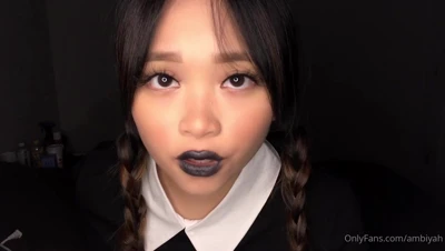 Candynxtdoor smirks with dark lips parted, braids framing her face