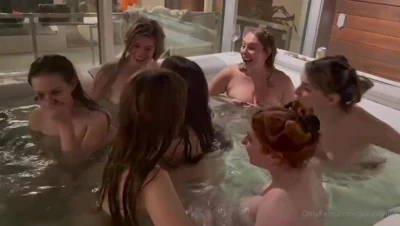 Isla-moon bares her chest in the hot tub while the wet, giggling girls kiss around her