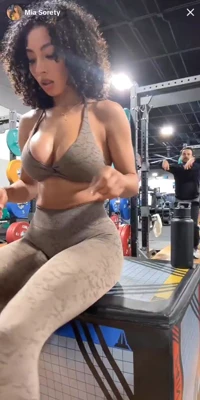 Gray halter and animal-print leggings, Mia Sorety is one horny little tease on the gym bench