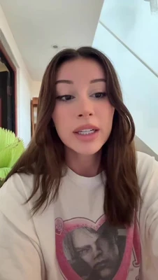 Chatting away in a loose white tee, Mikaela Testa keeps the banter flirty