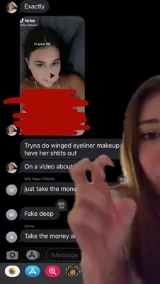 Mikaelatesta gasps wide-eyed at her phone, mouth open and too stunned to speak