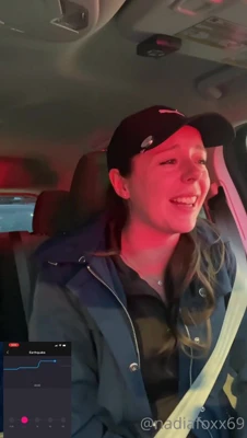 In a black Puma cap and navy jacket, Nadia Foxx unzips to flash her cleavage