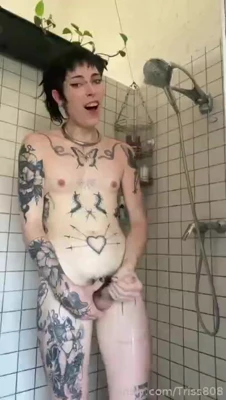 Nicole jerks her hard cock under the running shower