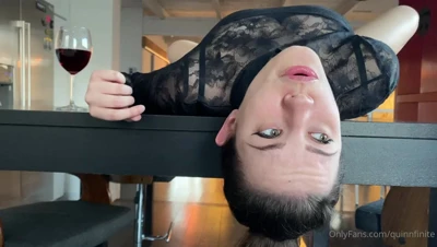 Hanging upside down off the counter, Quinn Finite licks her lips like she's hungry for it