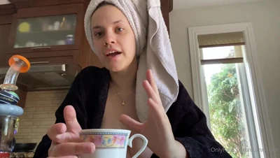 Quinn Finite flashes her big natural tits in the kitchen, grinning like she knows exactly what she's doing