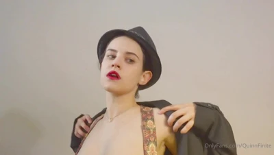 Pulling her bra cups down, Quinn Finite lets her big tits spill out and squeezes them