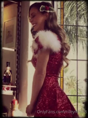 Riley Reid peels off her horny Santa dress and fingers her pussy on the Christmas tree floor