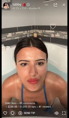 Blue floral bikini and cream-slicked Tabby, horny in the bathtub