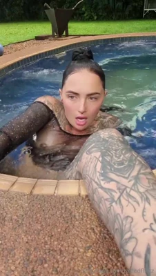 Soaking wet in a backyard pool, Muddy's pierced tits get squeezed while another girl gropes her from behind