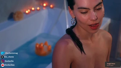 Thecheriemag sinks into a bubble bath, scrubbing her feet while her big tits slip through the foam
