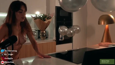Thecheriemag kneels on the counter, glitter-slicked and hungry, tits bouncing as she arches for more
