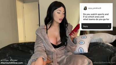 Willow Harper gets chatty and flirty in an open grey robe on her black satin bed