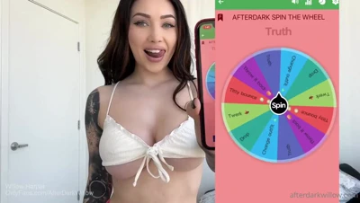 Coral thong and white bikini, then a black crop top for Willow Harper's spin-the-wheel dare